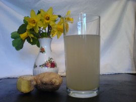 Glass of Ginger Beer, Fresh Ginger and flowers from the garden.